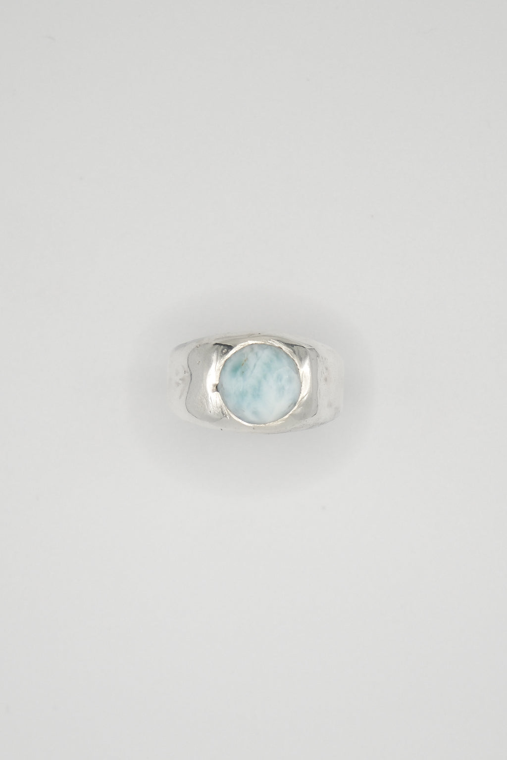 Chunky Sol and Mani Cloud ring featuring a blue Larimar stone set in a silver band, showcasing a modern, textured design.