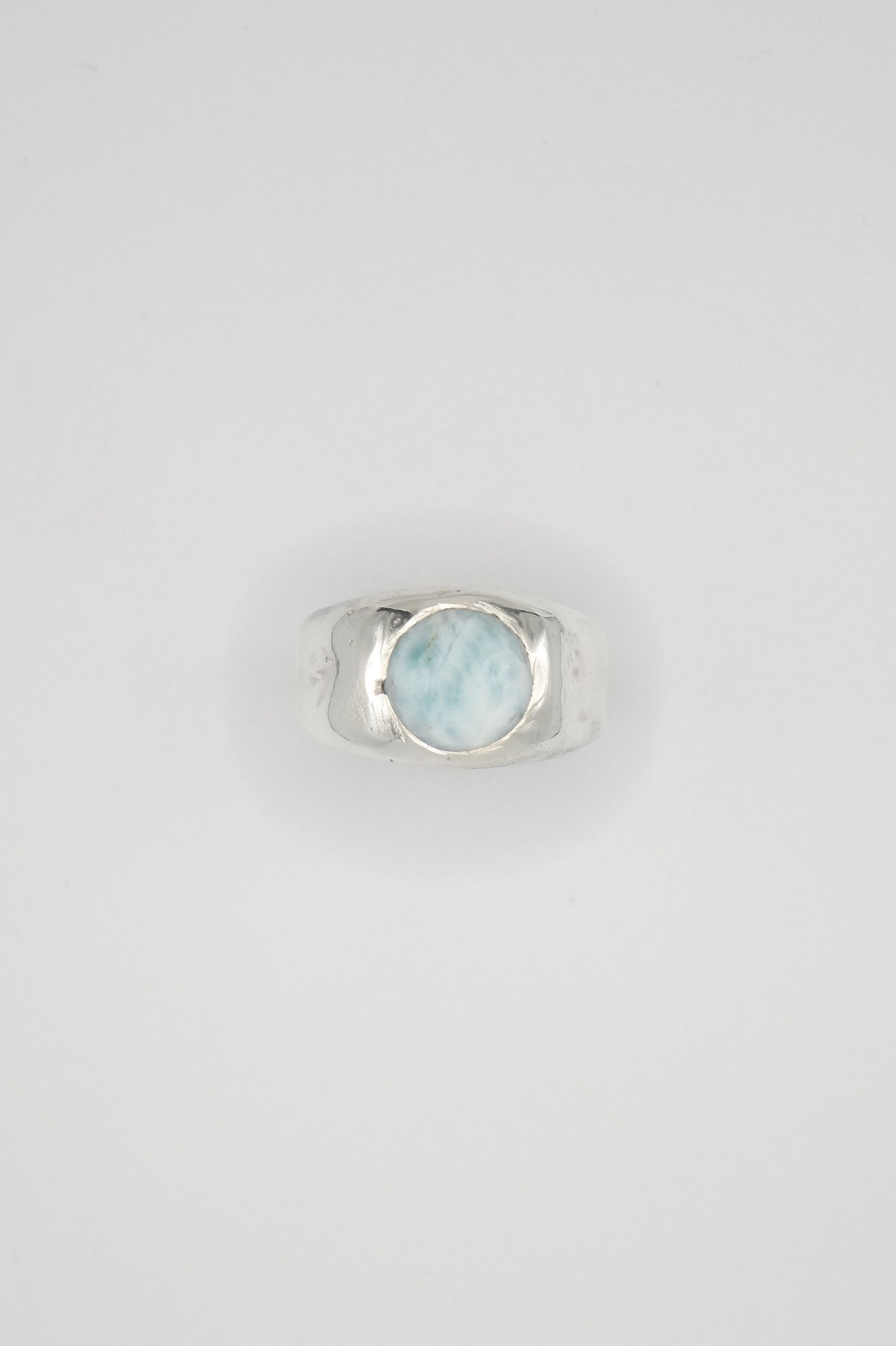 Chunky Sol and Mani Cloud ring featuring a blue Larimar stone set in a silver band, showcasing a modern, textured design.