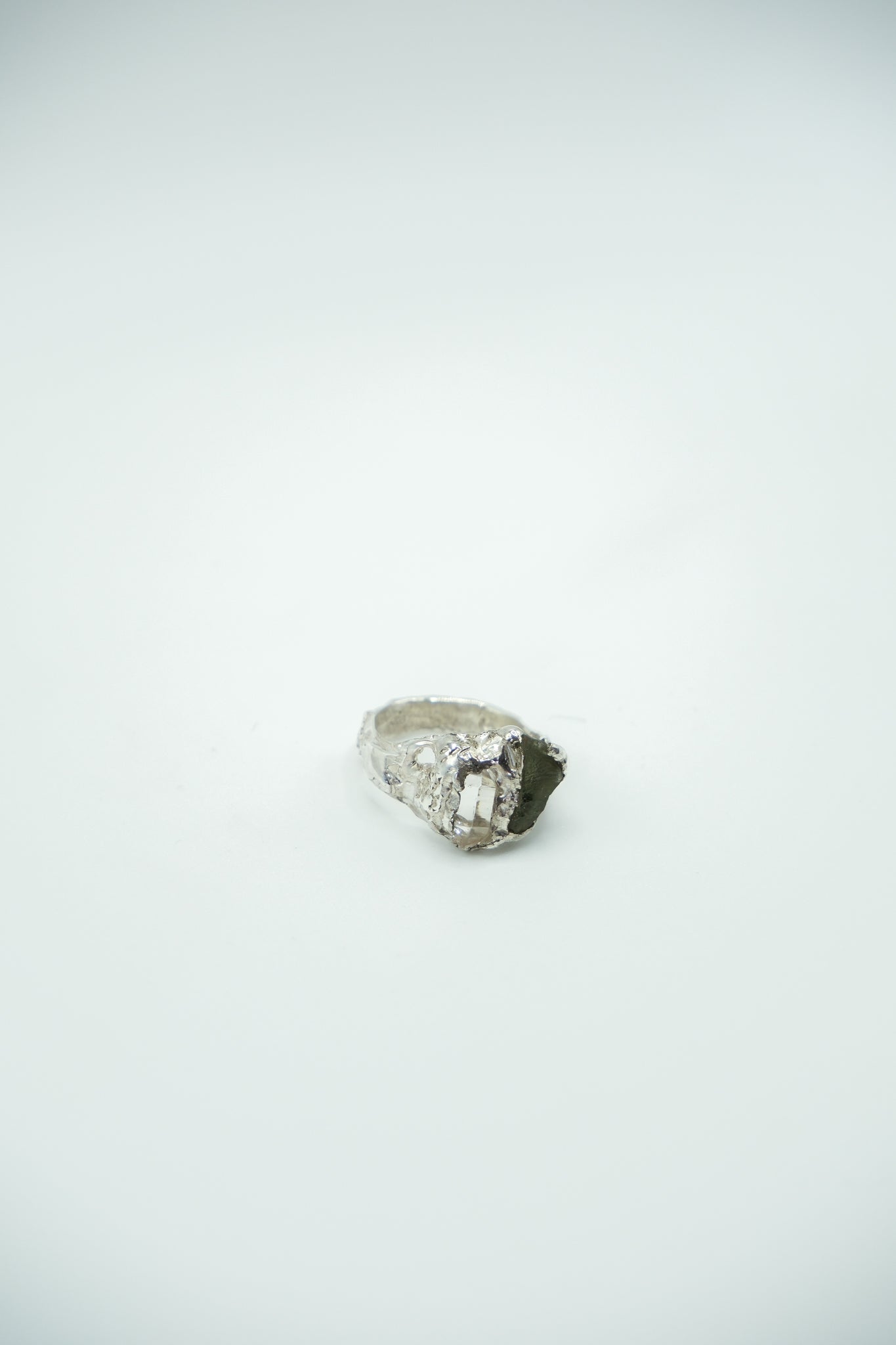 Moldavite and diamond quartz pendant called Earth by Sol and Mani, featuring green moldavite and sparkling clear quartz.