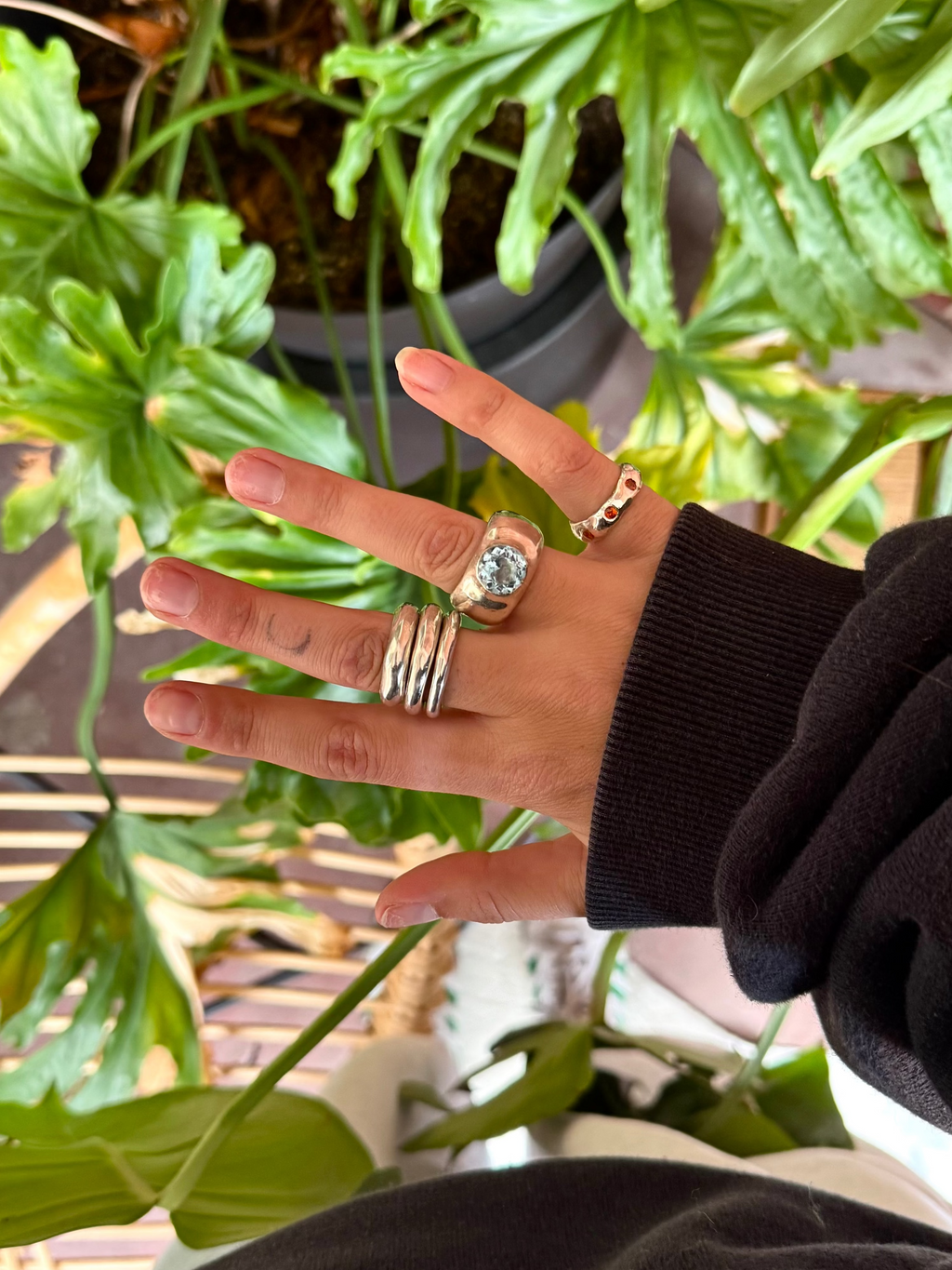 Large Sol and Mani Mira ring featuring a prominent blue topaz stone set in a stylish band.