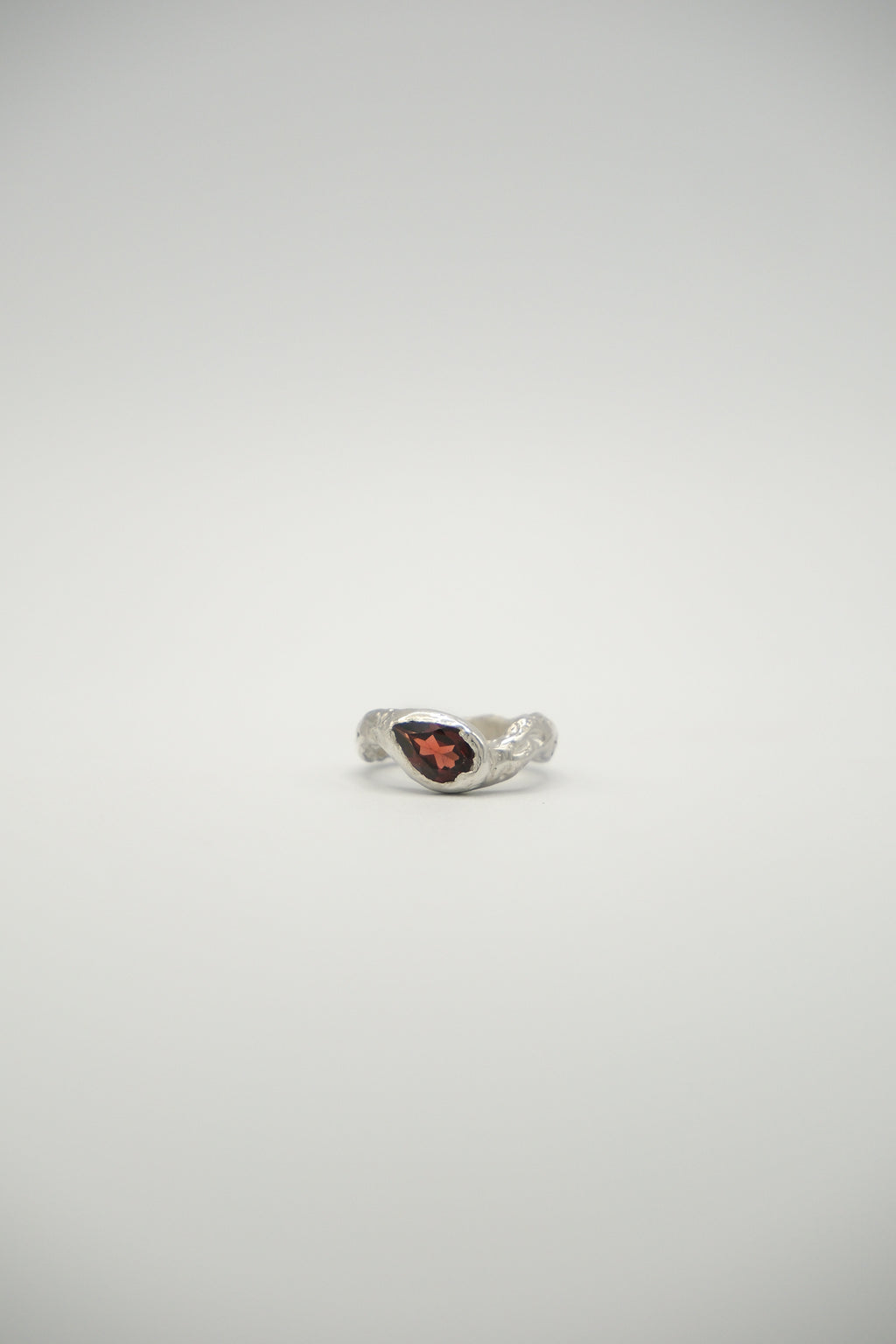 Pear-shaped lunar gemstone from Sol and Mani featuring a smooth, polished surface and a soft, luminous glow.