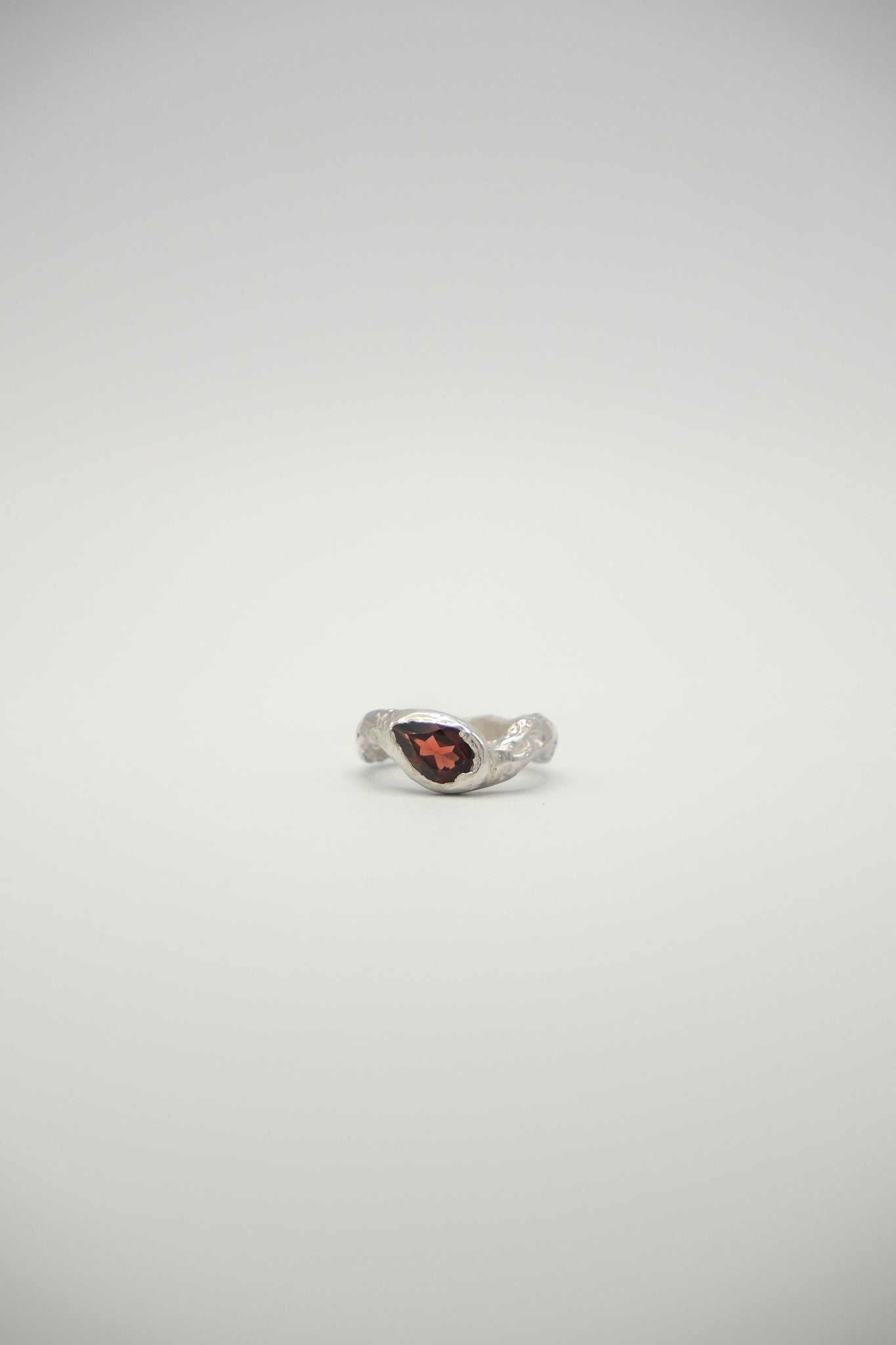Pear-shaped lunar gemstone from Sol and Mani featuring a smooth, polished surface and a soft, luminous glow.
