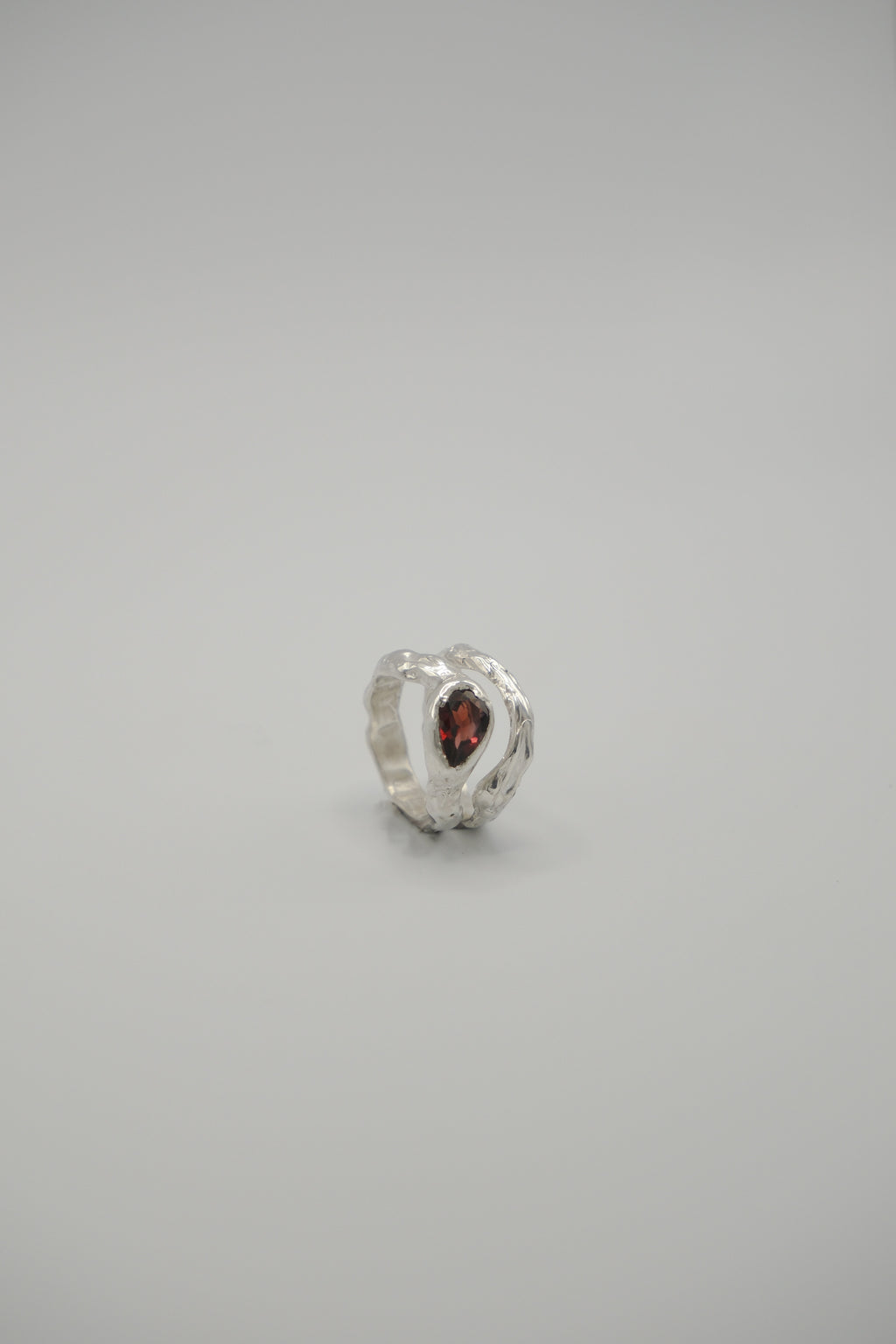 Pear-shaped Lunar gemstone by Sol and Mani, showcasing its smooth, polished surface and elegant pear cut.