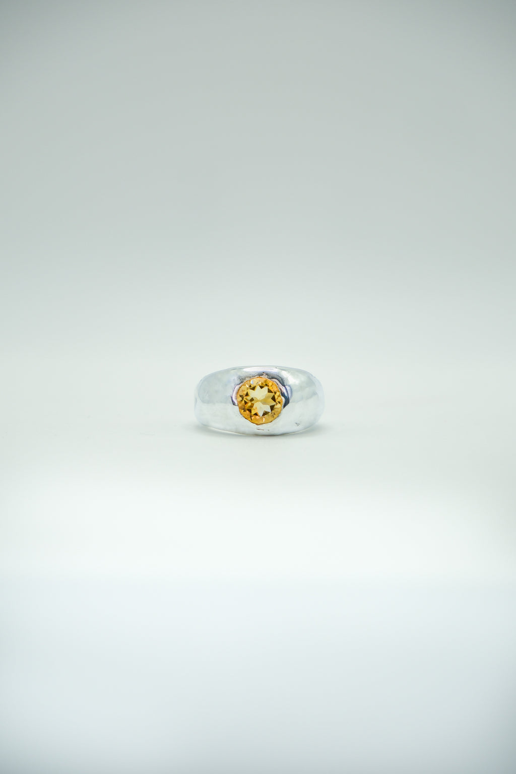 Citrine orange stone ring featuring a large honey-colored gemstone set in silver jewelry by Sol and Mani.