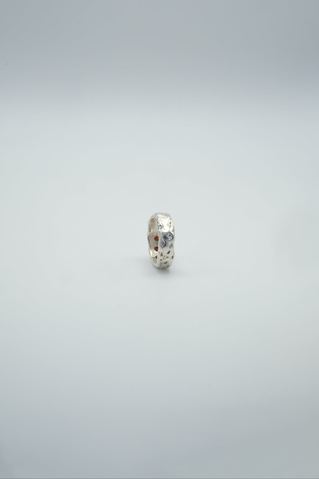Sol and Mani Jupiter 3 red stone ring featuring a bold design with vibrant red gemstones and a sleek band.