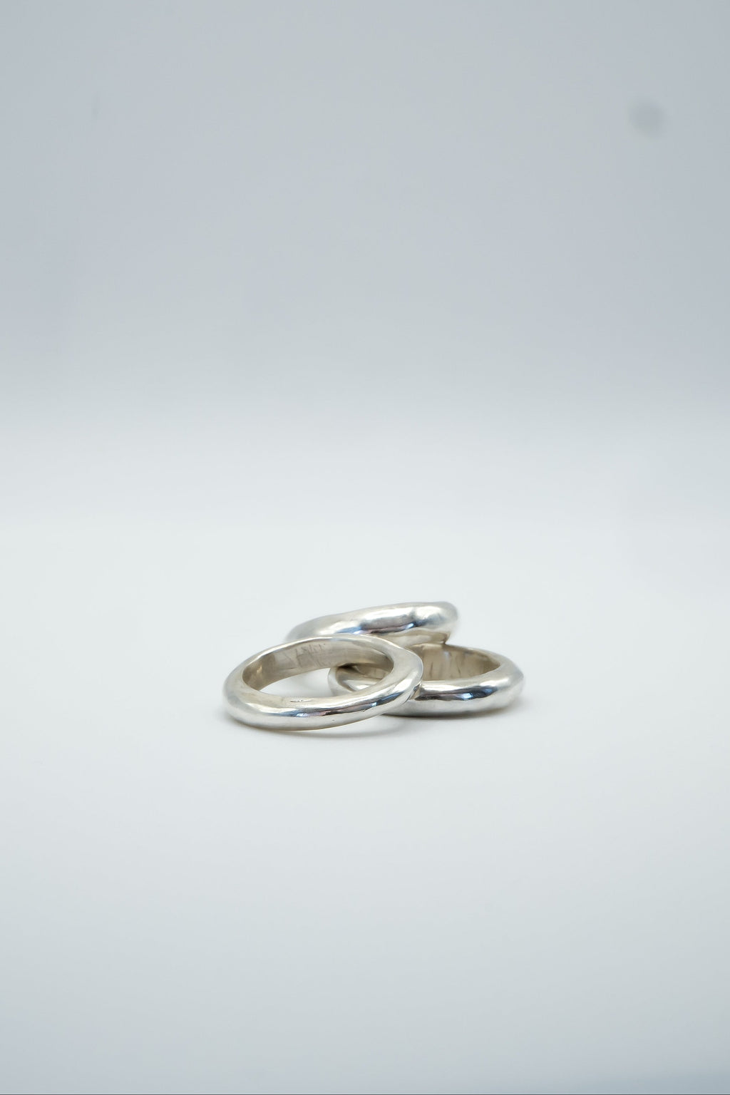 Three stack rings inspired by pancakes for dinner, featuring gold-tone bands with textured, layered pancake-like designs by Sol and Mani.